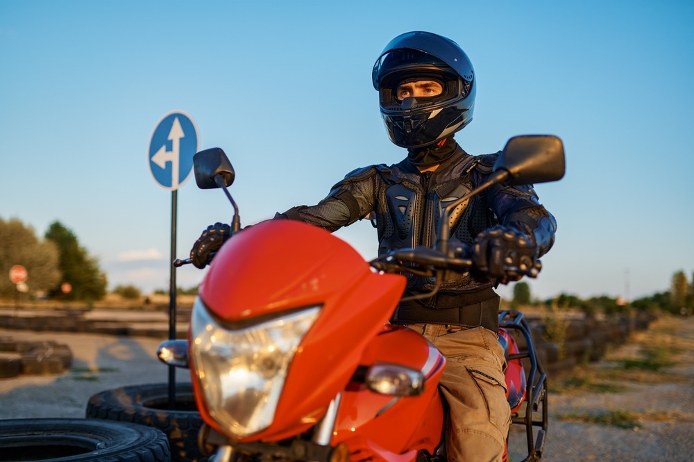 Motorcyclist riding a red bike for a profitable motorcycle insurance franchise opportunity.