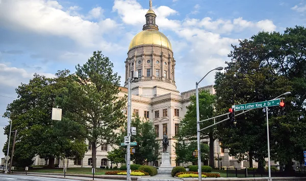 Georgia State Capitol Building and surrounding gardens, as seen from nearby intersection - Atlanta, Georgia, USA.