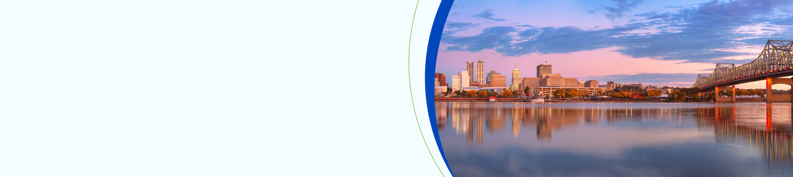 Peoria, Illinois, USA. Panoramic cityscape image of Peoria skyline, Illinois, USA with reflection of city lights in the Illinois River at autumn sunrise.