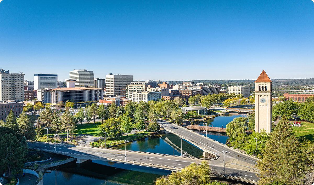 Aerial view of Spokane, WA with bridges crossing the river and a clock tower